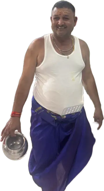 Pandit Shailendra Vyas inside Shri Mahakaleshwar Temple carrying a kalash